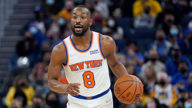 New York Knicks guard Kemba Walker dribbles the ball up the court against the Golden State Warriors during the first half of an NBA basketball game in San Francisco, Thursday, Feb. 10, 2022.