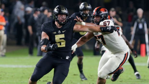 Purdue defensive end George Karlaftis (5) evades Oregon State offensive lineman Joshua Gray (67) during the fourth quarter of an NCAA college football game, Saturday, Sept. 4, 2021 at Ross-Ade Stadium in West Lafayette. Cfb Purdue Vs Oregon State