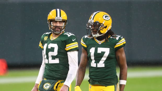 Green Bay Packers quarterback Aaron Rodgers (12) and wide receiver Davante Adams (17) against the Los Angeles Rams during the NFC Divisional Round at Lambeau Field.