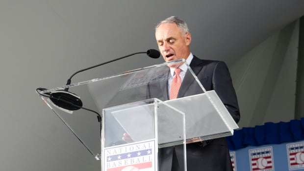 Sep 8, 2021; Cooperstown, New York, USA; Baseball Commissioner Rob Manfred reads the inscription on Hall of Famer Inductee Derek Jeter Hall of Fame plaque during the 2021 National Baseball Hall of Fame induction ceremony at Clark Sports Center. Mandatory Credit: Gregory Fisher-USA TODAY Sports
