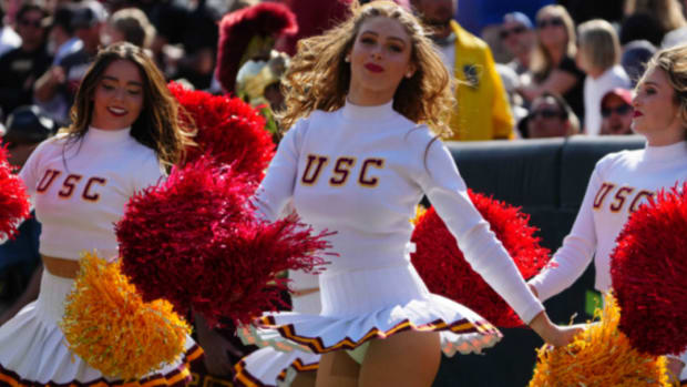Scenes at a college football game featuring the USC Trojans.