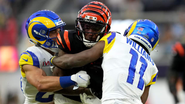 Cincinnati Bengals wide receiver Tee Higgins (85) competes for extra yardage after a catch as Los Angeles Rams cornerback Darious Williams (11) defends in the second quarter during Super Bowl 56, Sunday, Feb. 13, 2022, at SoFi Stadium in Inglewood, Calif. The Cincinnati Bengals lost, 23-30. Nfl Super Bowl 56 Los Angeles Rams Vs Cincinnati Bengals Feb 13 2022 1236
