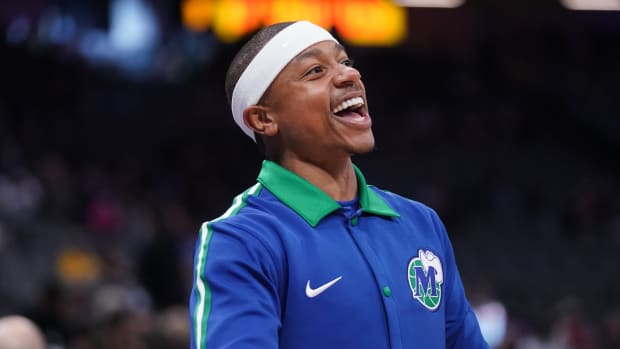 Mavericks guard Isaiah Thomas warms up before the start of a game against the Kings.