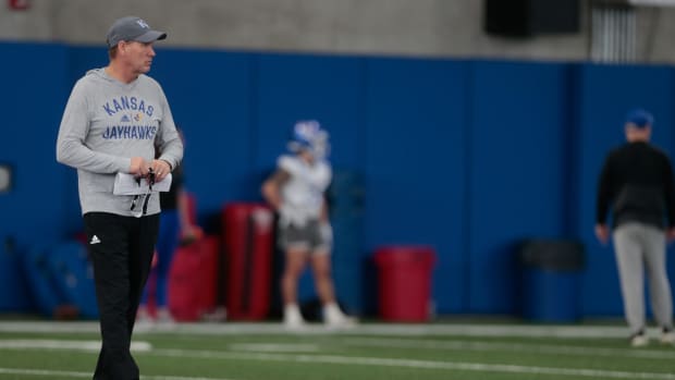 Kansas coach Lance Leipold walks on the field observing drills during practice Tuesday morning in Lawrence.