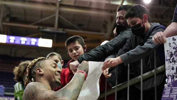 Nate Roberts accommodates some young fans with an autograph.