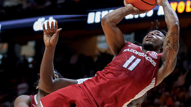 Arkansas Razorbacks guard Chris Lykes (11) shoots the ball against the Tennessee Volunteers during the second half at Thompson-Boling Arena.