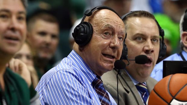 College basketball analyst Dick Vitale looks on during a game.