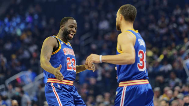 Dec 4, 2021; San Francisco, California, USA; Golden State Warriors forward Draymond Green (23) greets guard Stephen Curry (30) before the first quarter against the San Antonio Spurs at Chase Center. Mandatory Credit: Stan Szeto-USA TODAY Sports