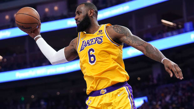 Los Angeles Lakers forward LeBron James (6) holds onto a rebound against the Golden State Warriors.