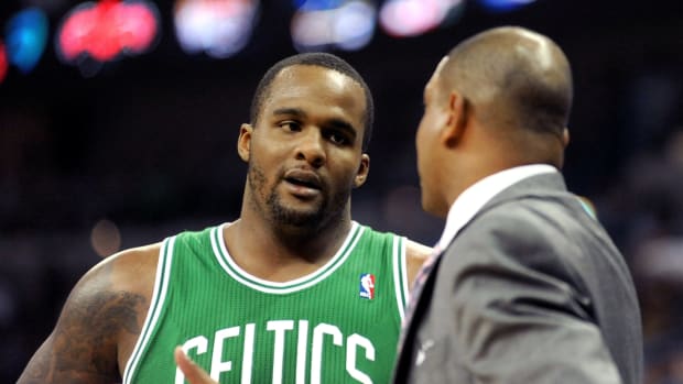 March 19, 2011; New Orleans, LA, USA; Boston Celtics power forward Glen Davis (11) talks with head coach Doc Rivers during their game against the New Orleans Hornets at the New Orleans Arena.