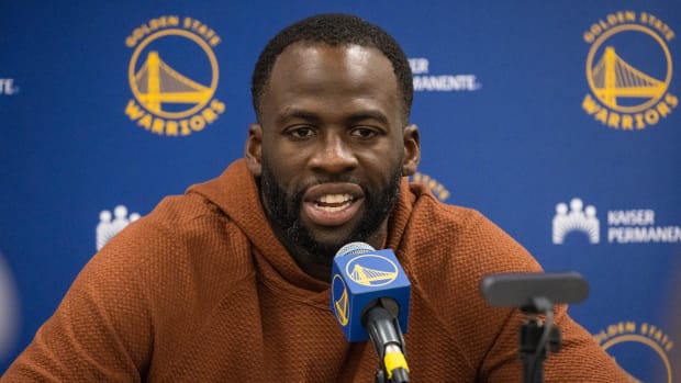 Warriors forward Draymond Green speaks to the media following a game against the Pacers.