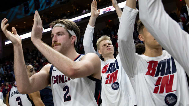 Gonzaga forward Drew Timme, left, celebrates with team members after defeating San Francisco in an NCAA semifinal college basketball game at the West Coast Conference tournament Monday, March 7, 2022, in Las Vegas.