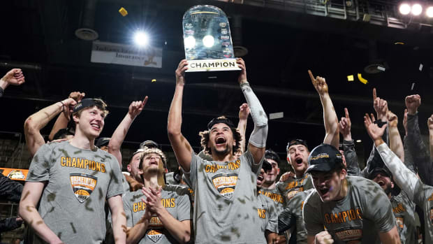 Mar 8, 2022; Indianapolis, IN, USA; The Wright State Raiders celebrate after winning the Horizon League championship game against the Northern Kentucky Norse at Indiana Farmers Coliseum.