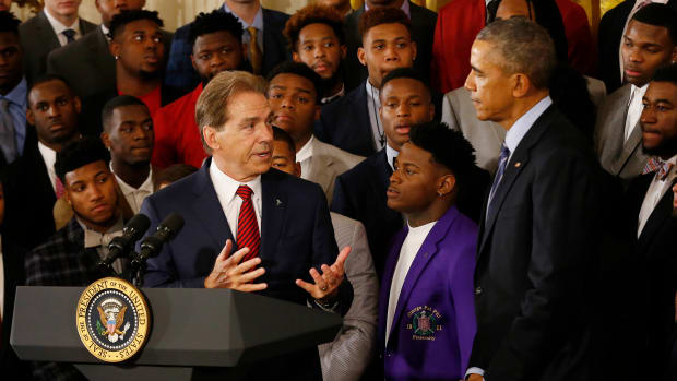 Washington, DC, USA; Alabama Crimson Tide head coach Nick Saban speaks as President Barack Obama (right) listens during a ceremony honoring the 2015 national champion Crimson Tide in the East Room at the White House.