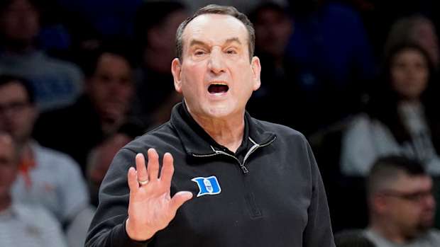 Duke head coach Mike Krzyzewski works the bench in the first half of an NCAA college basketball game against Syracuse during quarterfinals of the Atlantic Coast Conference men's tournament, Thursday, March 10, 2022, in New York.