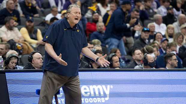 Mar 9, 2022; Kansas City, MO, USA; West Virginia Mountaineers head coach Bob Huggins yells to his team in the first half against the Kansas State Wildcats at T-Mobile Center.
