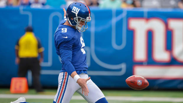 Aug 29, 2021; East Rutherford, New Jersey, USA; New York Giants punter Riley Dixon (9) punts the ball during the first half against the New England Patriots at MetLife Stadium.