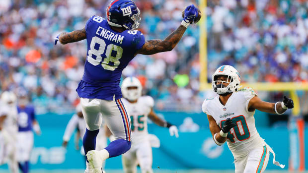 Dec 5, 2021; Miami Gardens, Florida, USA; New York Giants tight end Evan Engram (88) attempts a one-handed catch against Miami Dolphins free safety Nik Needham (40) during the second half at Hard Rock Stadium. Mandatory Credit: Sam Navarro-USA TODAY Sports