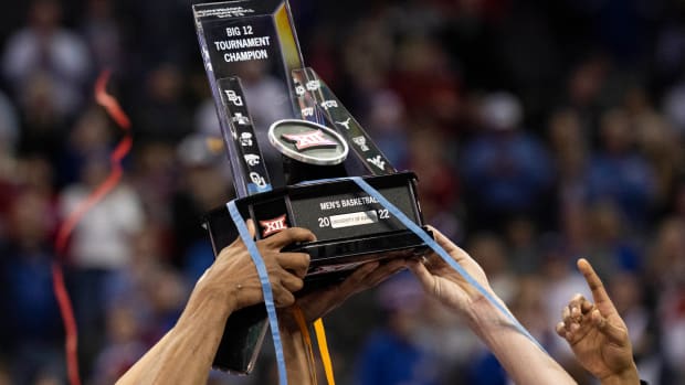 Mar 12, 2022; Kansas City, MO, USA; Kansas Jayhawks players hoist the Big 12 Tournament trophy after defeating the Texas Tech Red Raiders at T-Mobile Center. Mandatory Credit: Amy Kontras-USA TODAY Sports