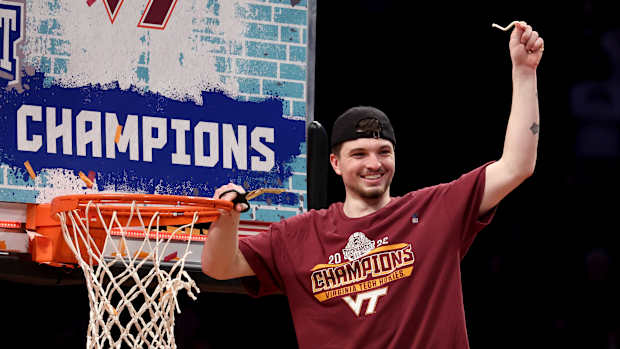 Virginia Tech Hokies guard Hunter Cattoor (0) cuts down the net after defeating the Duke Blue Devils 82-67 in the ACC Men’s Basketball Tournament final at Barclays Center.