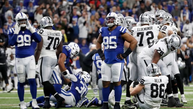 Indianapolis Colts players including Indianapolis Colts defensive tackle Taylor Stallworth (95) react Sunday, Jan. 2, 2022, after losing to the Las Vegas Raiders at Lucas Oil Stadium in Indianapolis.