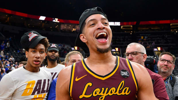 Loyola’s Lucas Williamson smiles after winning Arch Madness