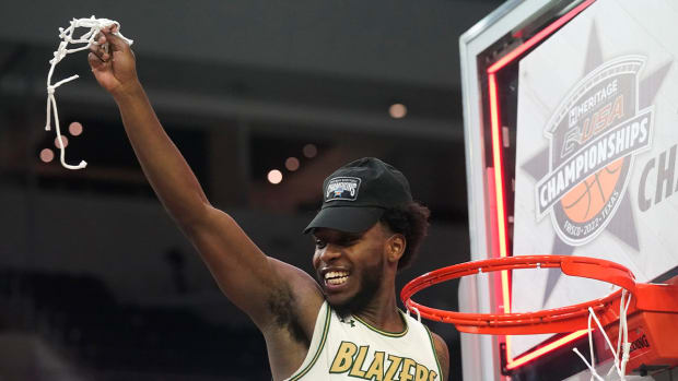 UAB guard Jordan Walker (10) holds up a piece of net after the team’s win over Louisiana Tech in an NCAA college basketball game for the championship of the Conference USA men’s tournament in Frisco, Texas, Saturday, March 12, 2022. UAB won 82-73.