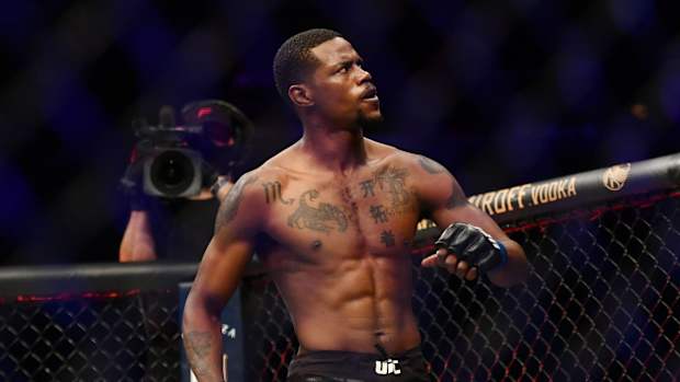 UFC fighter Kevin Holland looks on.