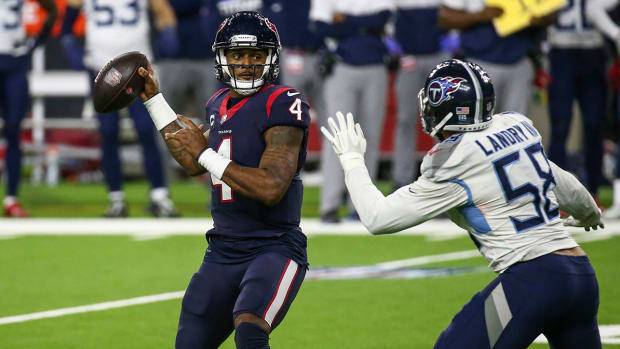 Houston Texans quarterback Deshaun Watson (4) attempts a pass as Tennessee Titans outside linebacker Harold Landry (58) defends during the fourth quarter at NRG Stadium.