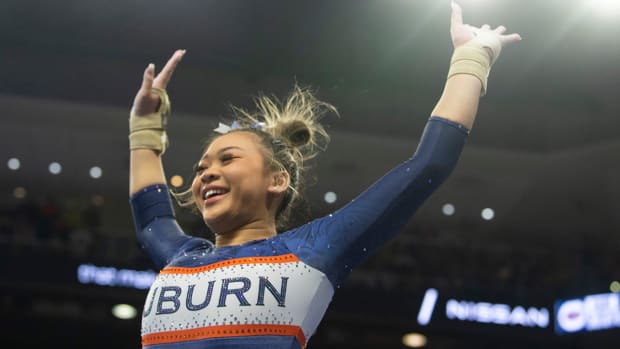 Auburn’s Suni Lee reacts after her vault performance as Auburn Tigers gymnastics takes on Florida Gators at Neville Arena.