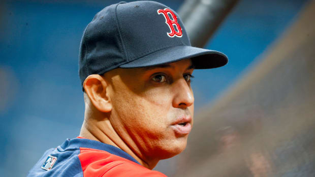 Oct 8, 2021; St. Petersburg, Florida, USA; Boston Red Sox manager Alex Cora (13) watches warm ups before the game between the Tampa Bay Rays and the Boston Red Sox in game two of the 2021 ALDS at Tropicana Field.