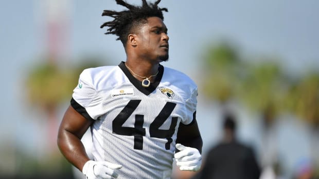 Myles Jack works out at practice.