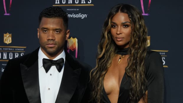 Russell Wilson and his wife Ciara appears on the red carpet prior to the NFL Honors awards