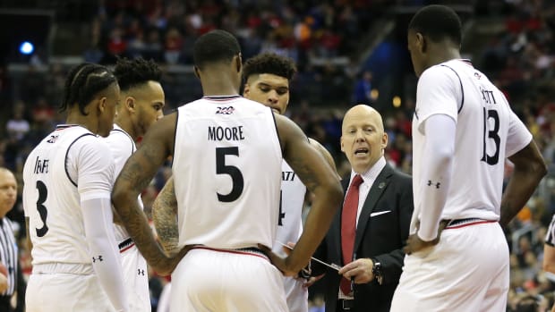 Cincinnati Bearcats head coach Mick Cronin talks to the team during a timeout in the second half of the NCAA Tournament Round of 64 game against the Iowa Hawkeyes, Friday, March 22, 2019, at Nationwide Arena in Columbus, Ohio. Cincinnati Bearcats lost to the Iowa Hawkeyes 79-72. Cincinnati Bearcats Vs Iowa Hawkeyes 3 22 2019