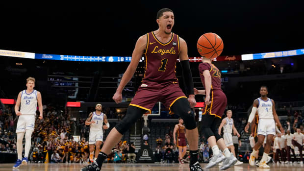Loyola of Chicago’s Lucas Williamson (1) celebrates during the first half of an NCAA college basketball game against Drake in the championship of the Missouri Valley Conference tournament Sunday, March 6, 2022, in St. Louis.