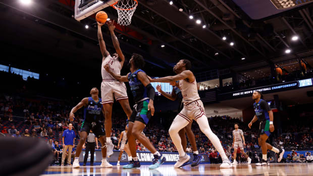 Mar 15, 2022; Dayton, OH, USA; Texas Southern Tigers forward Brison Gresham (44) goes to the basket pressured by Texas A&M-CC Islanders forward San Antonio Brinson (23) in the first half during the First Four of the 2022 NCAA Tournament at UD Arena. Mandatory Credit: Rick Osentoski-USA TODAY Sports