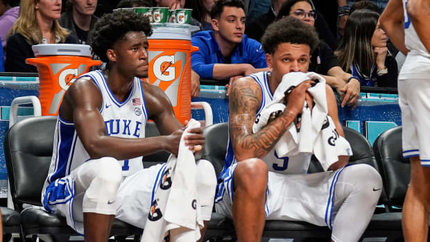 Duke’s Trevor Keels and Paolo Banchero look dejected on the bench