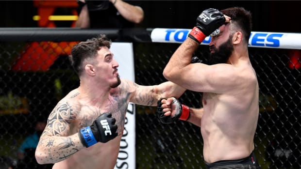 Feb 20, 2021; Las Vegas, NV, USA; Tom Aspinall of England punches Andrei Arlovski of Belarus in a heavyweight bout during the UFC Fight Night event at UFC APEX on February 20, 2021 in Las Vegas, Nevada.
