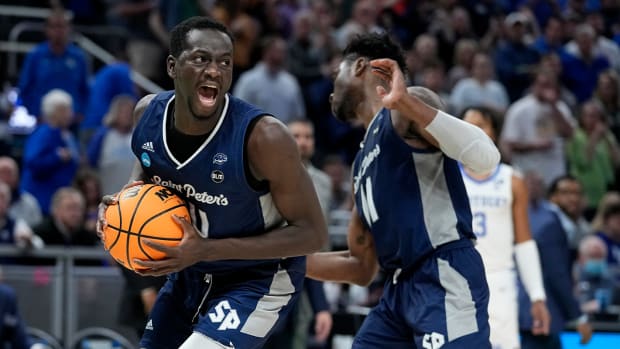 Saint Peter’s forward Hassan Drame celebrates after grabbing a rebound during overtime in a college basketball game against Kentucky in the first round of the NCAA tournament, Thursday, March 17, 2022, in Indianapolis. Saint Peter’s won 85-79.