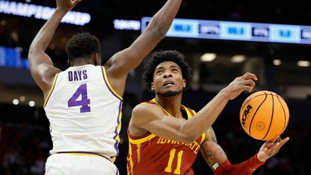 Iowa State’s Tyrese Hunter shoots past LSU’s Darius Days during the first half of a first round NCAA college basketball tournament game Friday, March 18, 2022, in Milwaukee.