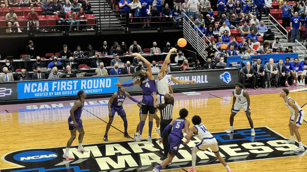 Photo of tip-off to start the game between Seton Hall Men's Basketball team and TCU Men's Basketball team
