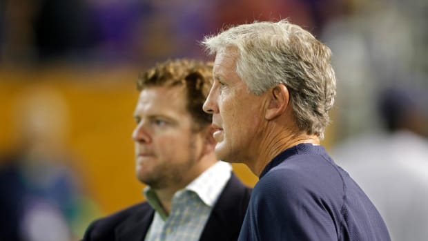 NFL: Preseason-Seattle Seahawks at Minnesota Vikings Aug 28, 2010; Minneapolis, MN, USA; Seattle Seahawks head coach Pete Carroll speaks with general manager John Schneider prior to the game against the Minnesota Vikings at the Metrodome.