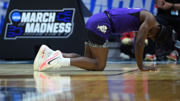 Mar 20, 2022; San Diego, CA, USA; TCU Horned Frogs forward Emanuel Miller (2) reacts after bloody nose in the overtime period against the Arizona Wildcats during the second round of the 2022 NCAA Tournament at Viejas Arena. Mandatory Credit: Orlando Ramirez-USA TODAY Sports