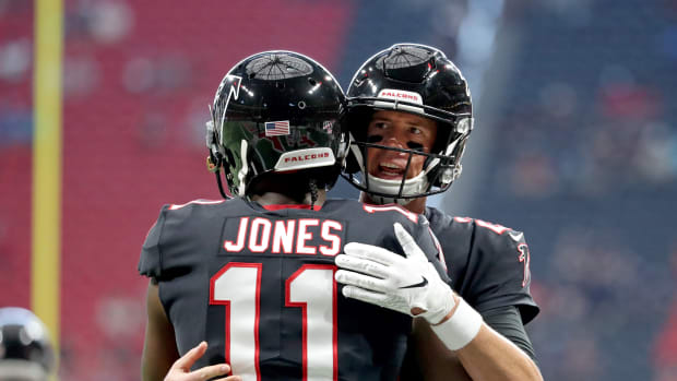 Sep 29, 2019; Atlanta, GA, USA; Atlanta Falcons wide receiver Julio Jones (11) greets quarterback Matt Ryan (2) before their game against the Tennessee Titans at Mercedes-Benz Stadium.