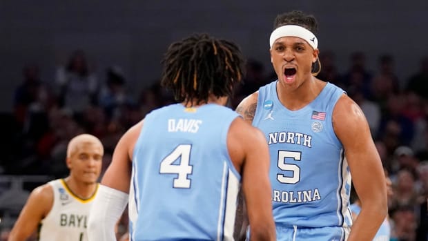 North Carolina guard RJ Davis (4) and forward Armando Bacot (5) celebrate in the second half of a second-round game against Baylor in the NCAA college basketball tournament in Fort Worth, Texas, Saturday, March, 19, 2022.