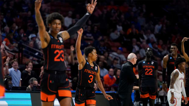 Miami celebrates after scoring during the second half of a college basketball game against Auburn in the second round of the NCAA tournament on Sunday, March 20, 2022, in Greenville, S.C.