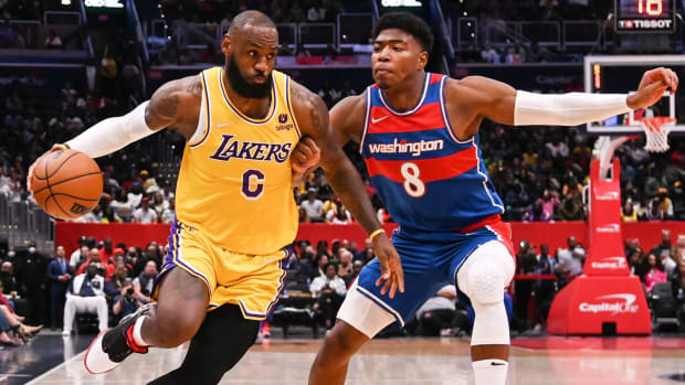 Los Angeles Lakers forward LeBron James makes a move on Washington Wizards forward Rui Hachimura.