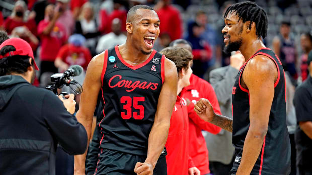 Houston men’s basketball players celebrate after a Sweet 16 win.
