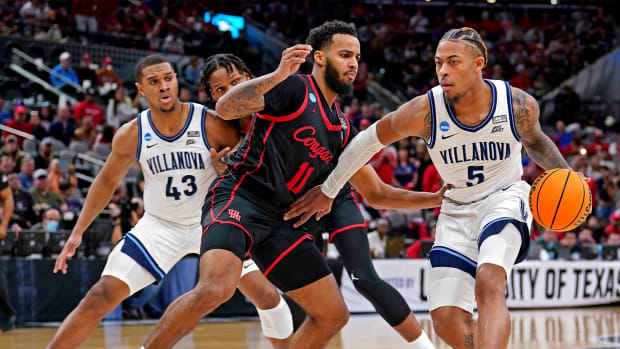 Mar 26, 2022; San Antonio, TX, USA; Villanova Wildcats guard Justin Moore (5) drives to the basket against Houston Cougars guard Kyler Edwards (11) during the second half in the finals of the South regional of the men's college basketball NCAA Tournament at AT&T Center.