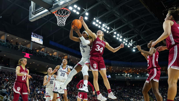 Indiana's Grace Berger tries to block the ball in the Hoosiers' Sweet 16 matchup versus UConn.